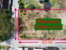 Aerial view of a vacant land plot for sale with dimensions and contact information