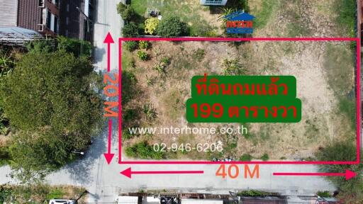 Aerial view of a vacant land plot for sale with dimensions and contact information