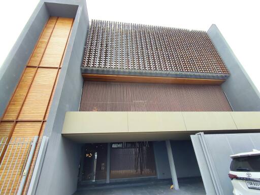 Modern residential exterior showcasing wooden slat architecture