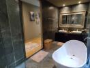 Modern spacious bathroom with freestanding tub and glass shower