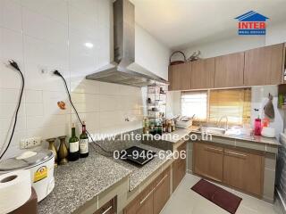 Modern kitchen with wooden cabinets and granite countertops