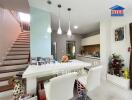 Modern kitchen with dining area and staircase