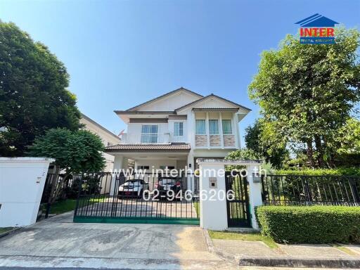 Spacious two-story house with front yard and parking.