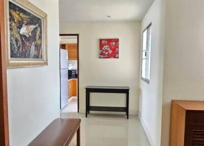 Bright and spacious hallway with art and seating