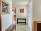 Bright and spacious hallway with art and seating