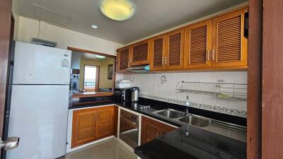 Spacious kitchen with modern appliances and wooden cabinets