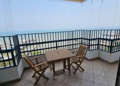 Seaside balcony with dining set overlooking the ocean