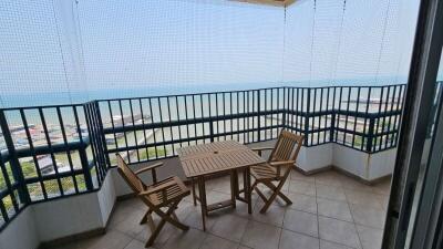 Seaside balcony with dining set overlooking the ocean