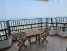 Seaside balcony with dining set overlooking the ocean