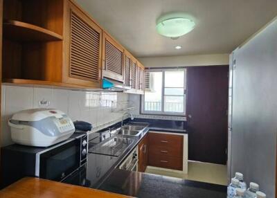 Well-equipped kitchen with modern appliances and ample cabinet space