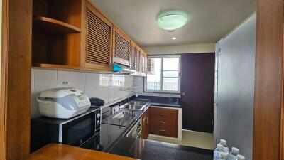 Well-equipped kitchen with modern appliances and ample cabinet space