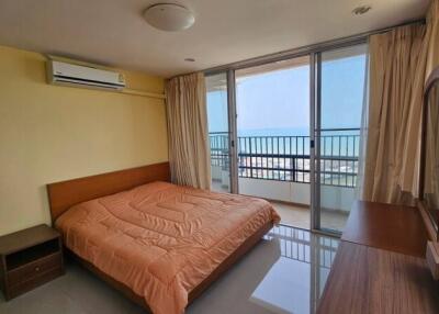 Bright bedroom with ocean view and balcony access