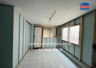 Spacious unfurnished living room with large windows and ample natural light