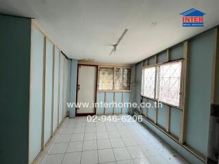 Spacious unfurnished living room with large windows and ample natural light