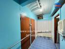 Brightly colored hallway in building featuring wooden doors and tiled floor