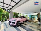 Luxurious home driveway with a modern pink sports car