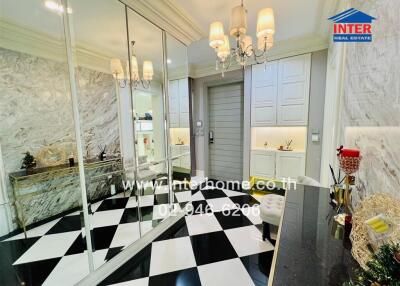 Elegant hallway with marble walls and checkered floor
