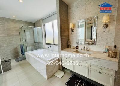 Luxurious modern bathroom with large mirror and spacious layout