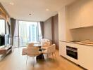 Modern apartment interior with open living room and kitchen area, featuring city views