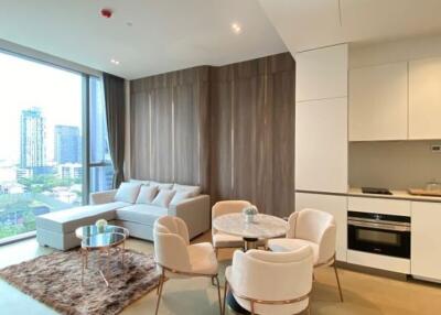 Modern living room with kitchen area in a high-rise apartment