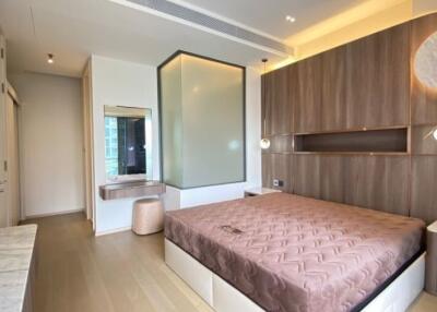 Modern bedroom with stylish interior design, wooden paneling and ample lighting