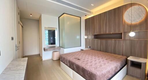 Modern bedroom with stylish interior design, wooden paneling and ample lighting