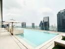 Luxury rooftop swimming pool with city skyline view