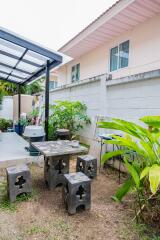 Outdoor patio with seating area in a residential backyard