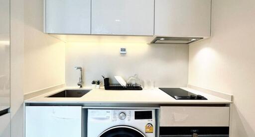 Modern white kitchen with built-in appliances