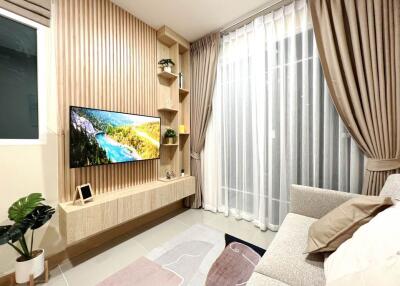 Cozy and modern bedroom with mounted TV and stylish decor
