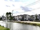 Luxurious residential neighborhood with landscaped pond and fountain