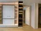 Modern living room interior with custom shelving and hidden lighting