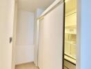 Compact laundry room with built-in appliances and ample lighting