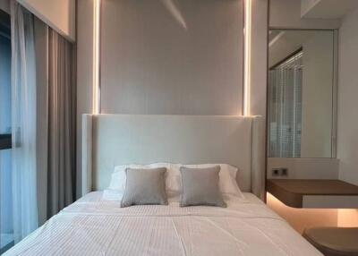 Modern bedroom with ambient lighting and minimalist design