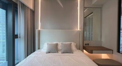 Modern bedroom with ambient lighting and minimalist design