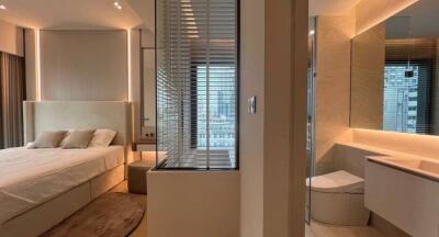 Modern bedroom with ensuite bathroom and city view