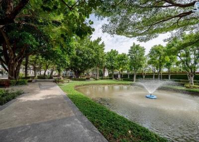 Beautiful garden area with pond and fountain in a residential community