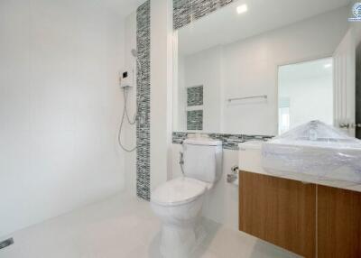 Modern bathroom with wooden vanity and stylish tiling