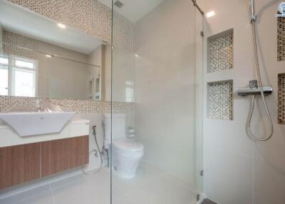 Modern bathroom with glass shower and elegant bathtub