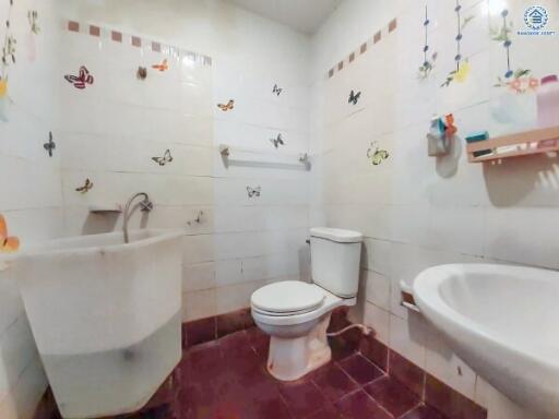 Brightly decorated bathroom with butterfly stickers