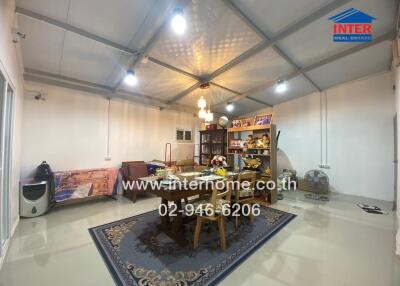 Spacious and well-lit living area with various amenities