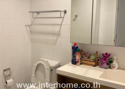 Modern bathroom interior with sanitary installations and mirror