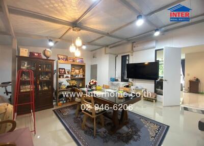 Spacious and well-lit living room with decor and modern amenities