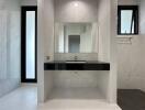 Modern bathroom with sleek design and ample natural light