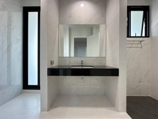 Modern bathroom with sleek design and ample natural light