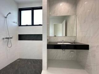 Modern bathroom with elegant fixtures and marble tiles