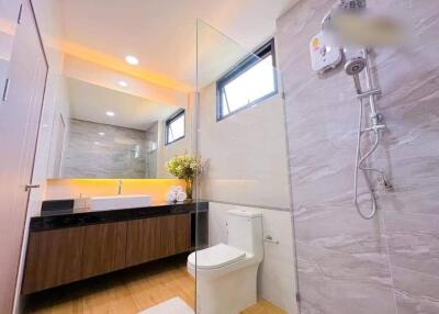 Modern bathroom with sleek fixtures and bright lighting