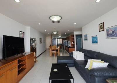 Spacious and well-lit living room with adjoining dining area