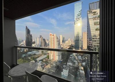 High-rise City View from Balcony with Seating