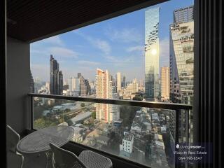 High-rise City View from Balcony with Seating